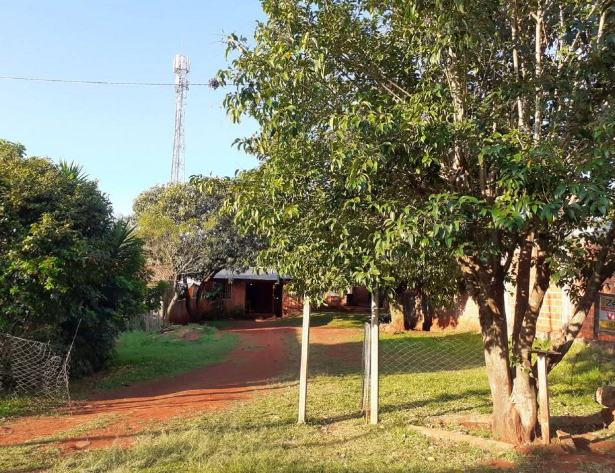 Terreno con casa precaria